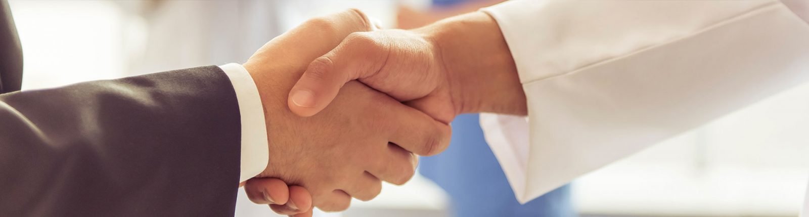 photo of clinician and client shaking hands